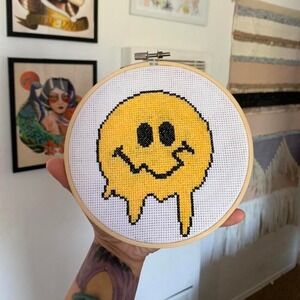 6 inch cross stitch of a melted‎ smiley face